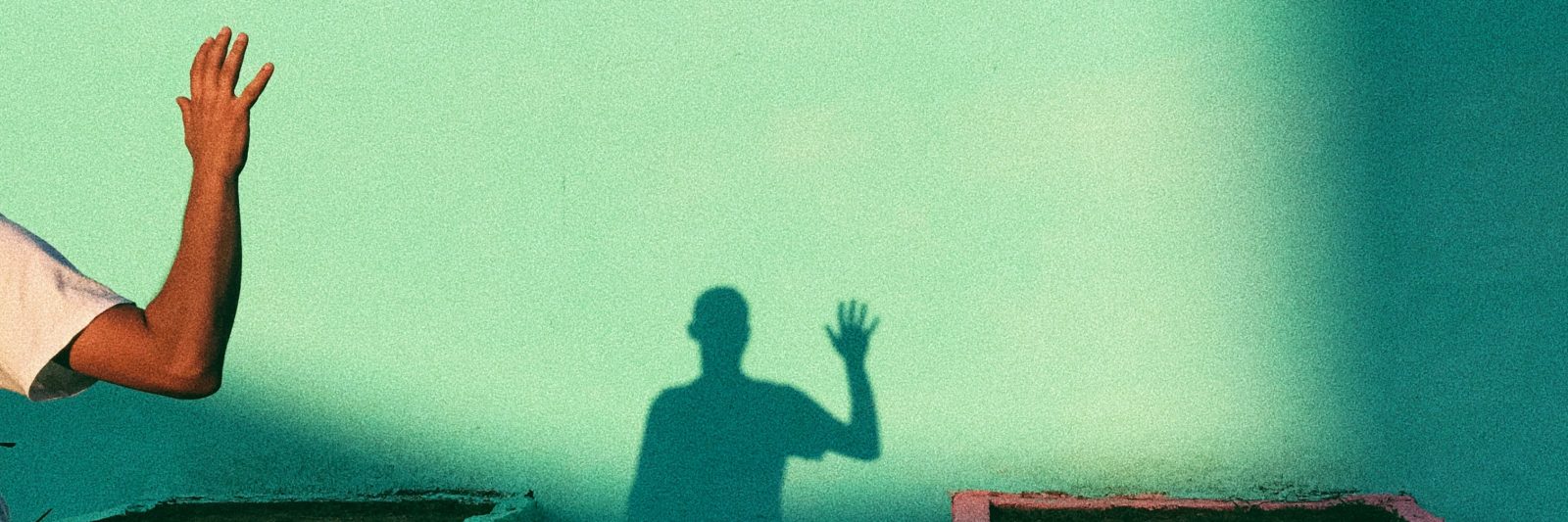 silhouette of arm waving